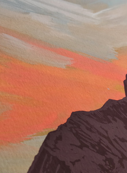 mountain painting against sunset